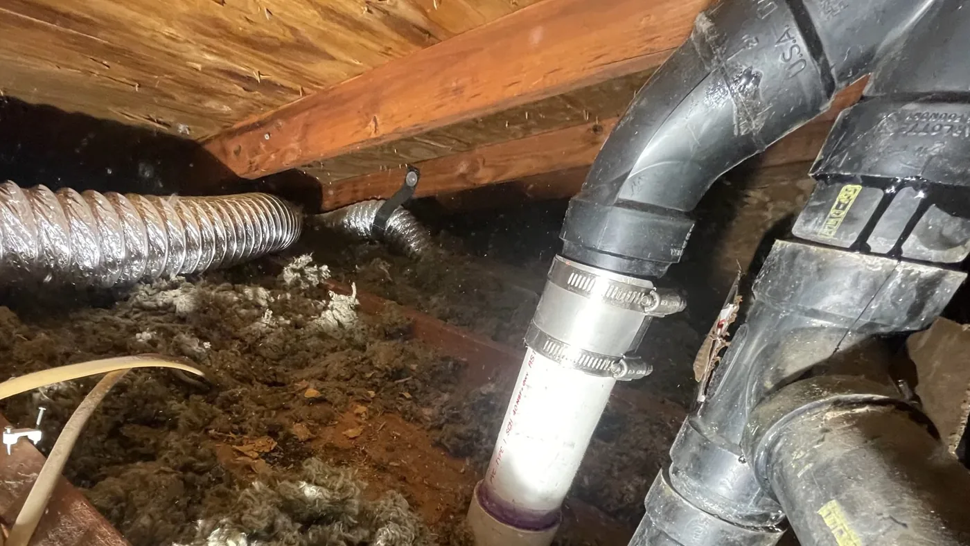 Exposed interior plumbing and pipe repair area used during residential community work near Buckeye, AZ