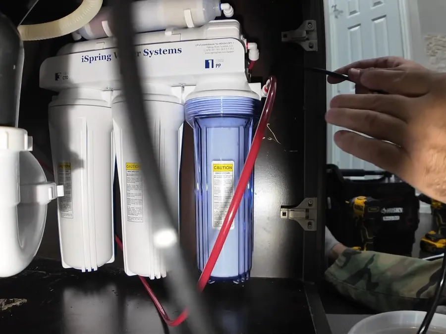 Under-sink reverse osmosis filtration system showing copper detail for reverse osmosis installation in Buckeye, AZ