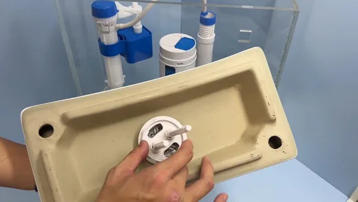Toilet tank parts and installation hardware used during toilet repair work near Buckeye, AZ