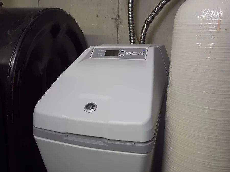 Water softener tank and brine system used during faucet and sink repair work near Buckeye, AZ