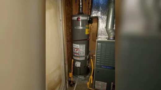 Water heater tank, piping, and service components used during residential community work near Cashion, AZ
